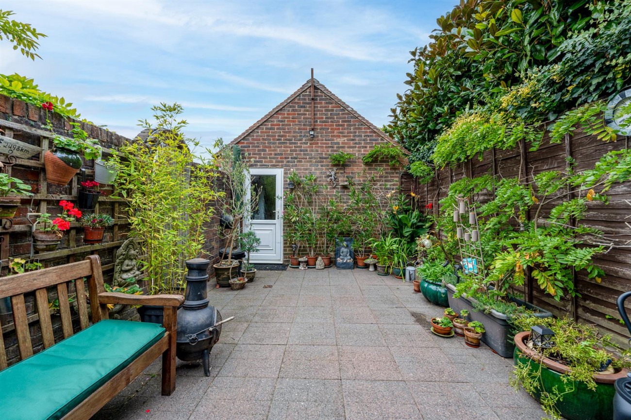 Enclosed Courtyard & Rear Access to Garage