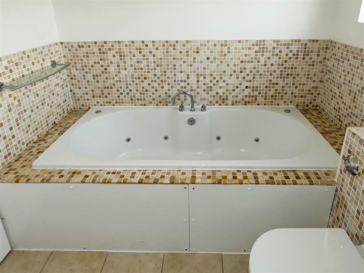 Upstairs Bathroom With Jacuzzi Bath.jpg
